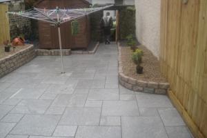 Granite paving with raised beds from project Granite Paving Ideas