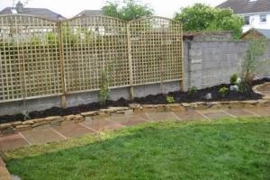 Timber fencing bolted to old unsightly wall from project Fencing and Walling