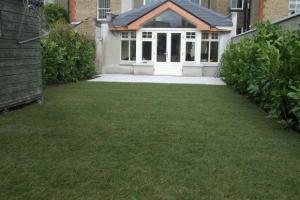 After from project Granite Patio and Natural Grass Lawn